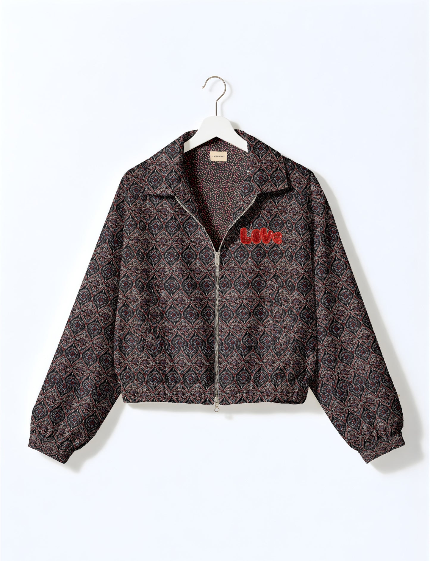 Love Bomber Jacket made from recycled fabric, featuring hand-stitched Aari embroidery. A unique piece of zero-waste clothing, part of the circular fashion movement. Designed with upcycled materials for a stylish yet environmentally friendly clothing choice.