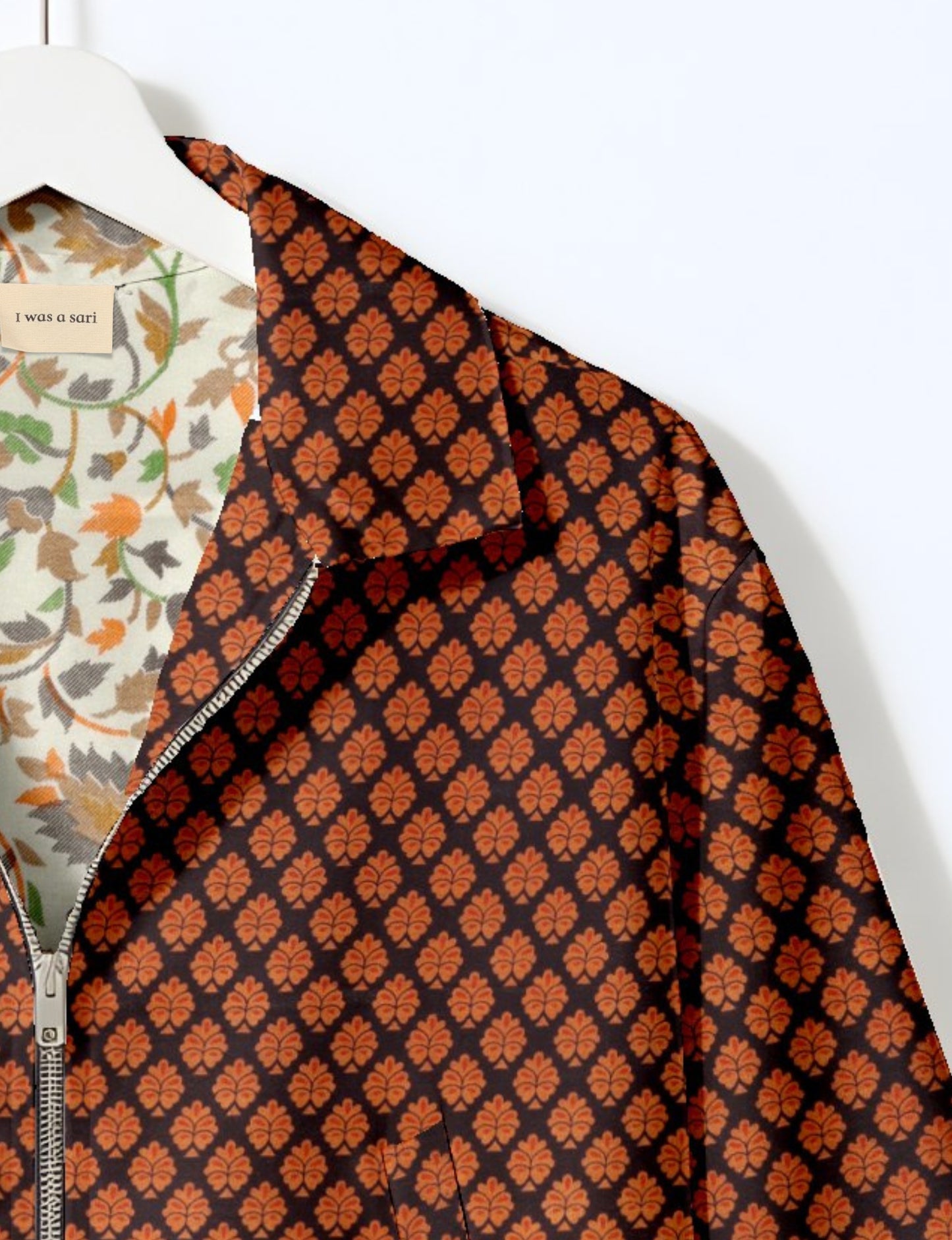 Upcycled Bomber Jacket made from recycled sari materials, featuring a cute cropped shape, elasticated hem and cuffs, and contrast sari print lining. Sustainable apparel promoting eco-friendly fashion and ethical clothing.
