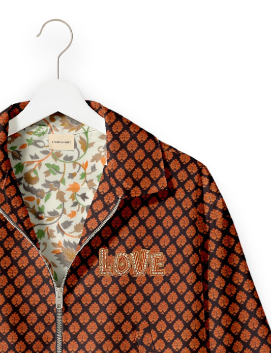 Love Bomber Jacket made from recycled fabric, featuring hand-stitched Aari embroidery. A unique piece of zero-waste clothing, part of the circular fashion movement. Designed with upcycled materials for a stylish yet environmentally friendly clothing choice.