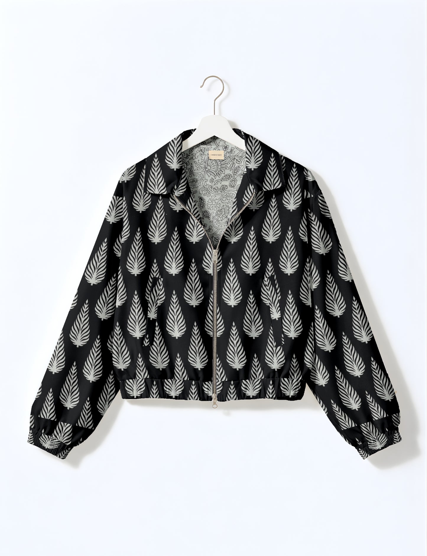 Upcycled Bomber Jacket made from recycled sari materials, featuring a cute cropped shape, elasticated hem and cuffs, and contrast sari print lining. Sustainable apparel promoting eco-friendly fashion and ethical clothing.