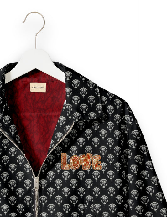 Love Bomber Jacket made from recycled fabric, featuring hand-stitched Aari embroidery. A unique piece of zero-waste clothing, part of the circular fashion movement. Designed with upcycled materials for a stylish yet environmentally friendly clothing choice.