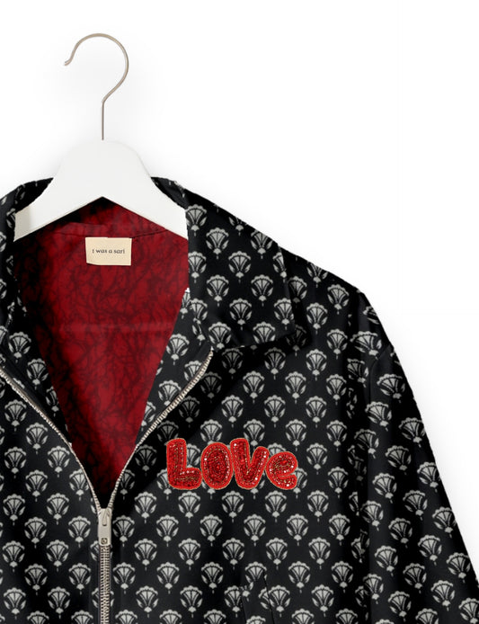 Love Bomber Jacket made from recycled fabric, featuring hand-stitched Aari embroidery. A unique piece of zero-waste clothing, part of the circular fashion movement. Designed with upcycled materials for a stylish yet environmentally friendly clothing choice.