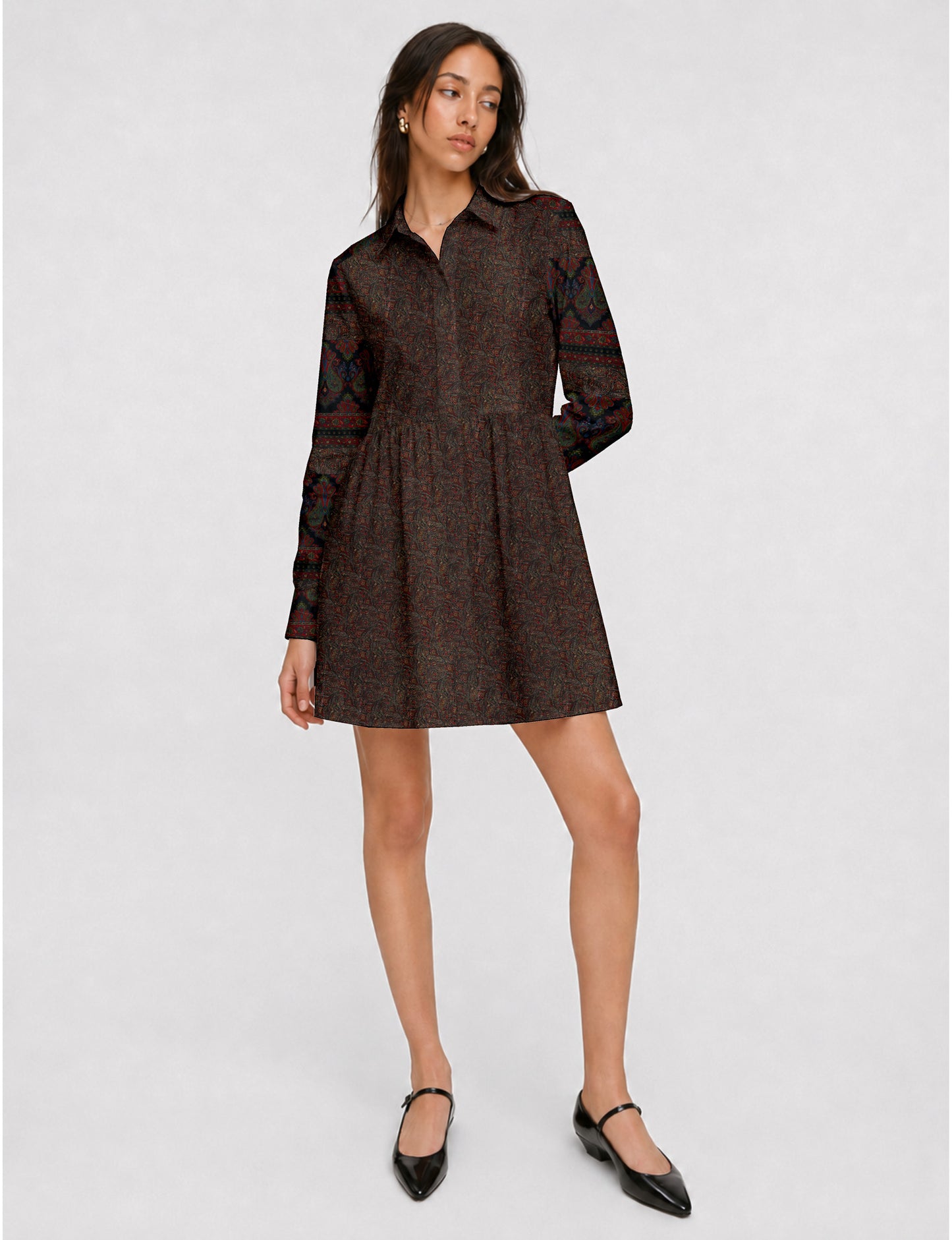 Short shirt dress with a relaxed A-line silhouette, point collar, partial button placket, gathered waist, side pockets, and full-length cuffed sleeves.