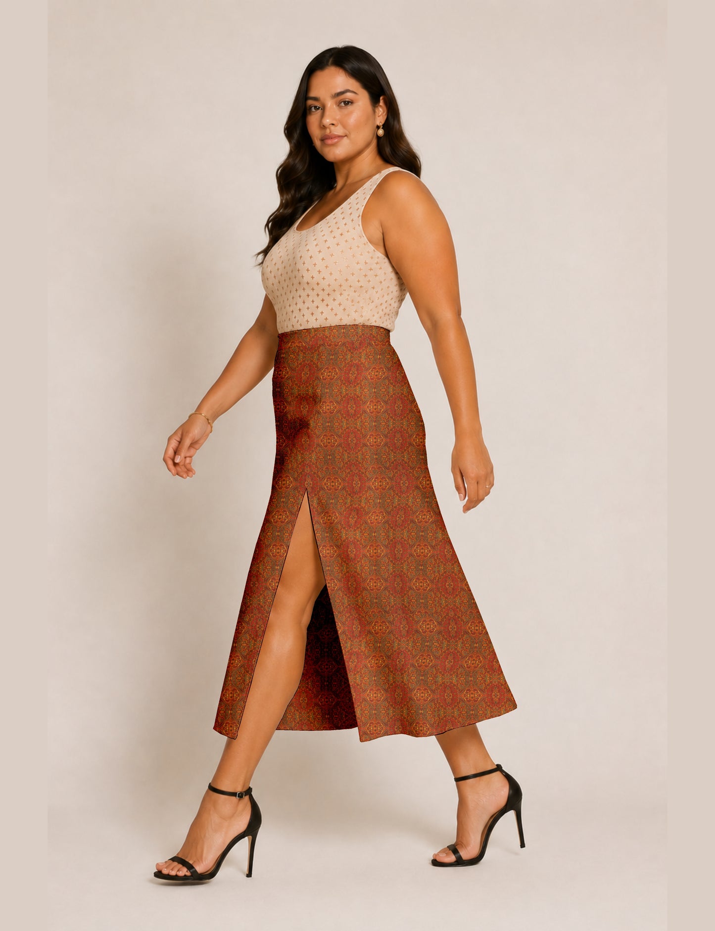 Woman wearing a yellow and navy blue A-line skirt with a slit and a sleeveless beige top with brown micro print