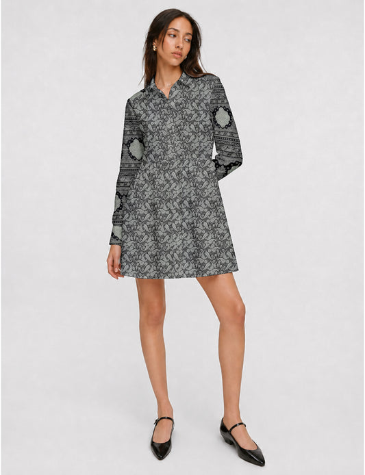 Short shirt dress with a relaxed A-line silhouette, point collar, partial button placket, gathered waist, side pockets, and full-length cuffed sleeves.