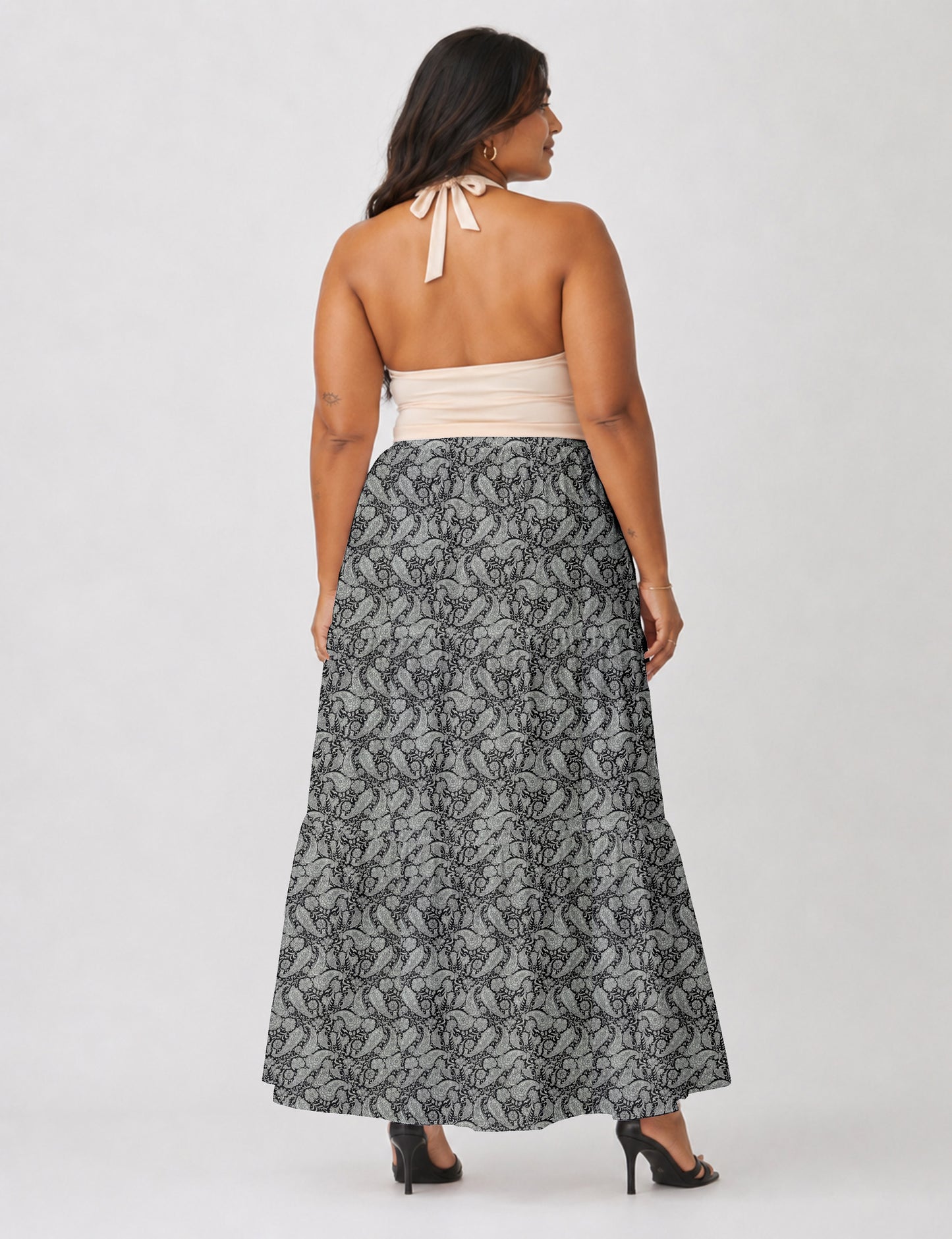 Yellow midi tiered skirt with small dark geometric micro pattern, flat lay front view