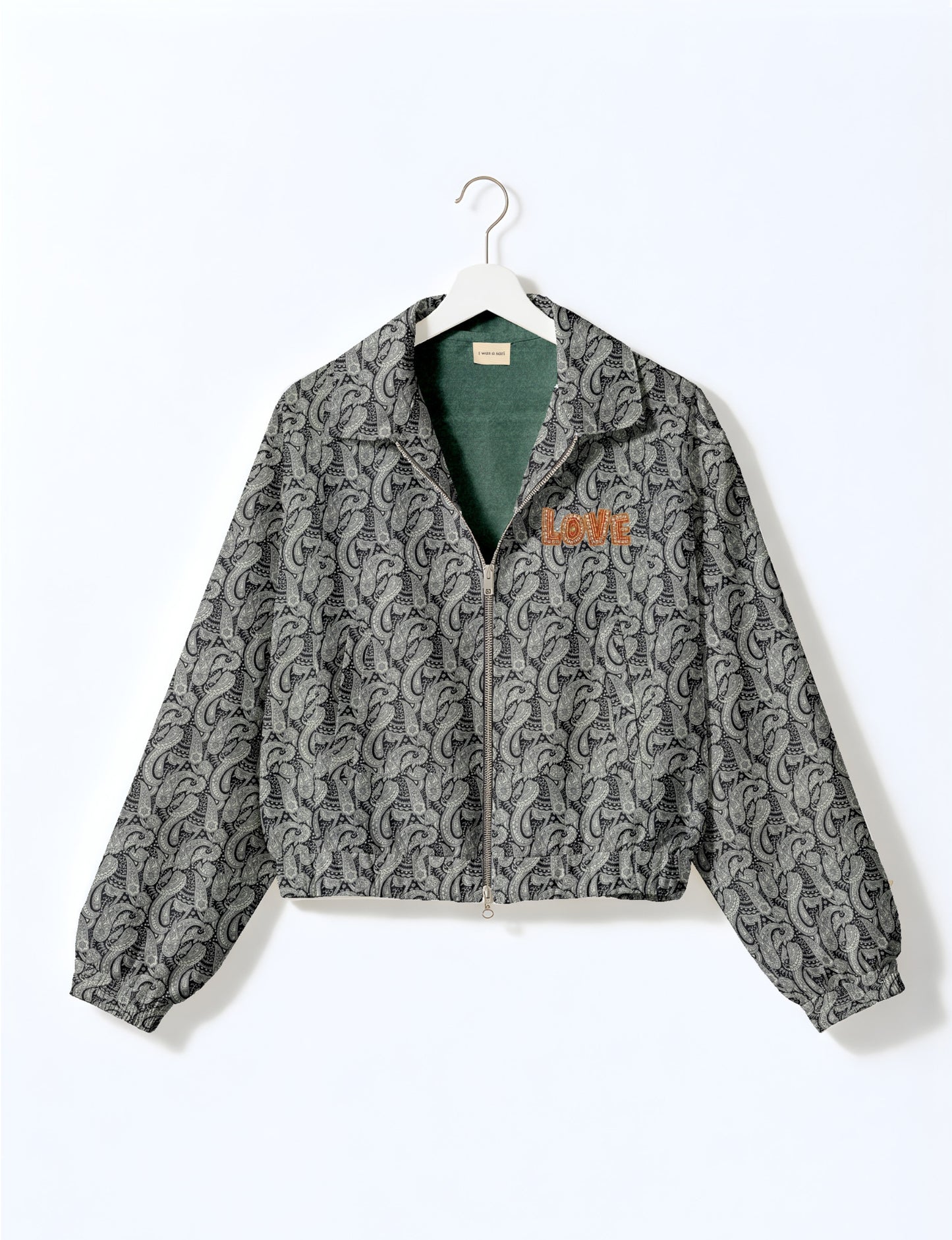 Love Bomber Jacket made from recycled fabric, featuring hand-stitched Aari embroidery. A unique piece of zero-waste clothing, part of the circular fashion movement. Designed with upcycled materials for a stylish yet environmentally friendly clothing choice.
