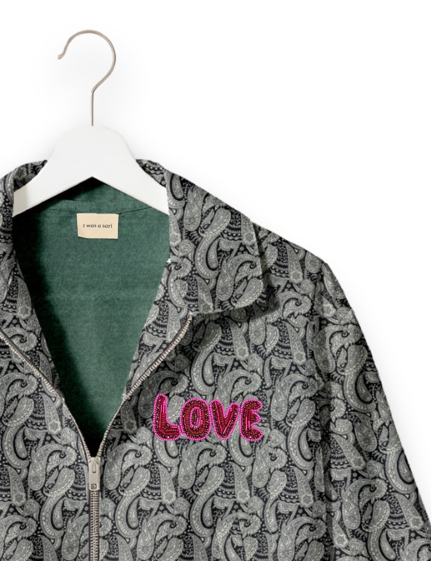 Love Bomber Jacket made from recycled fabric, featuring hand-stitched Aari embroidery. A unique piece of zero-waste clothing, part of the circular fashion movement. Designed with upcycled materials for a stylish yet environmentally friendly clothing choice.