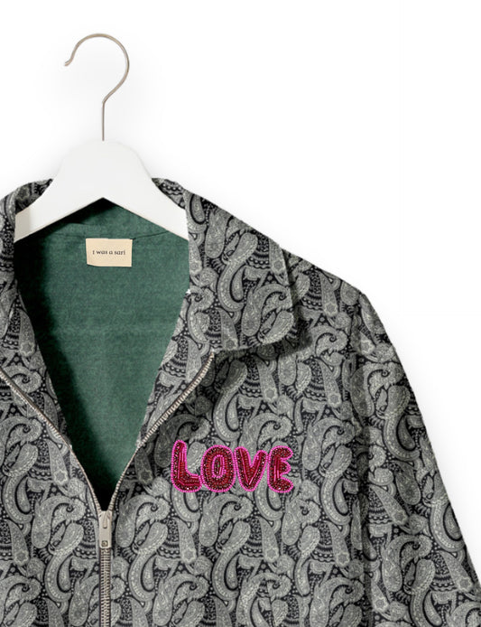 Love Bomber Jacket made from recycled fabric, featuring hand-stitched Aari embroidery. A unique piece of zero-waste clothing, part of the circular fashion movement. Designed with upcycled materials for a stylish yet environmentally friendly clothing choice.