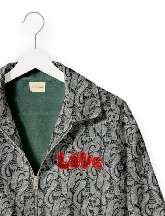 Love Bomber Jacket made from recycled fabric, featuring hand-stitched Aari embroidery. A unique piece of zero-waste clothing, part of the circular fashion movement. Designed with upcycled materials for a stylish yet environmentally friendly clothing choice.