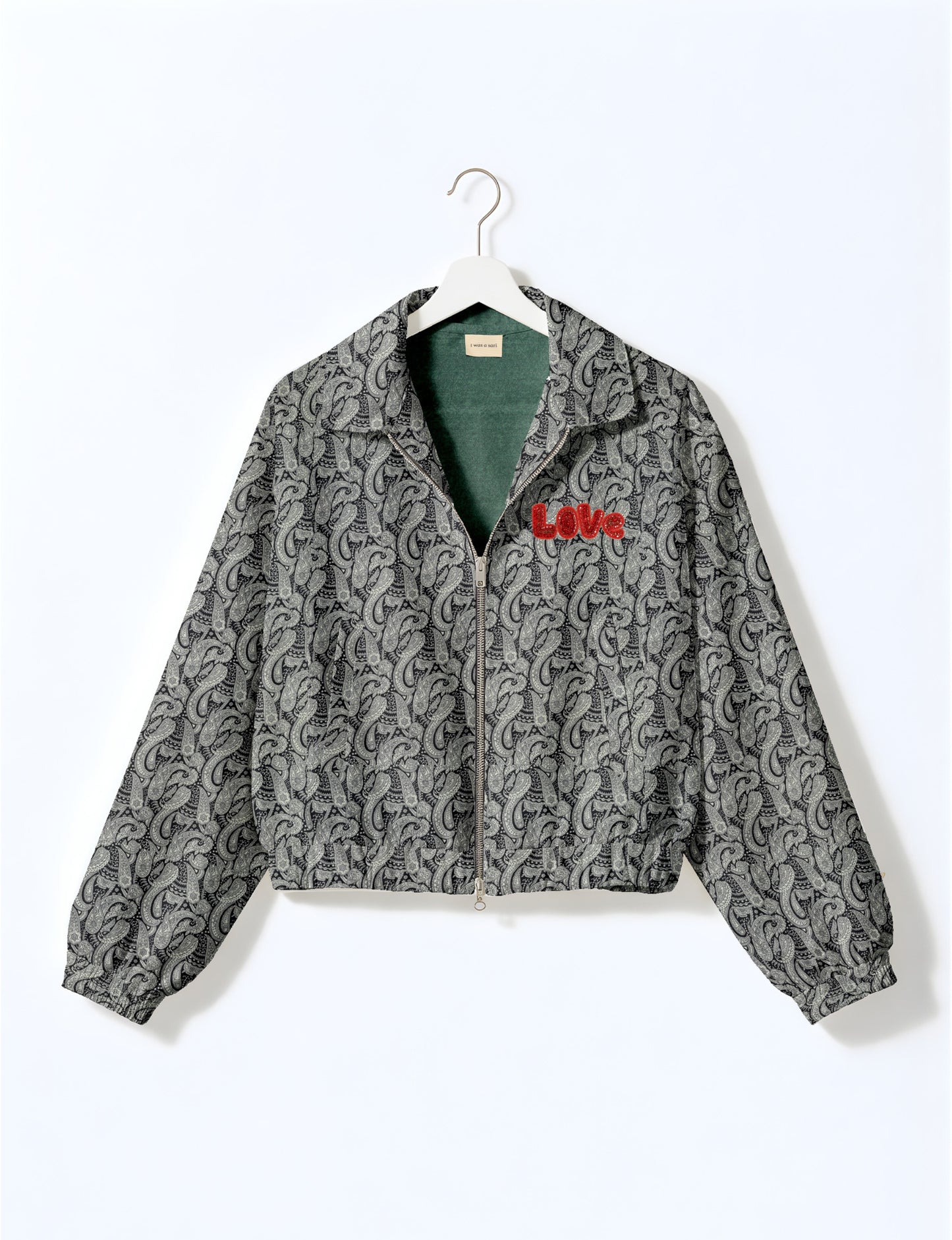 Love Bomber Jacket made from recycled fabric, featuring hand-stitched Aari embroidery. A unique piece of zero-waste clothing, part of the circular fashion movement. Designed with upcycled materials for a stylish yet environmentally friendly clothing choice.