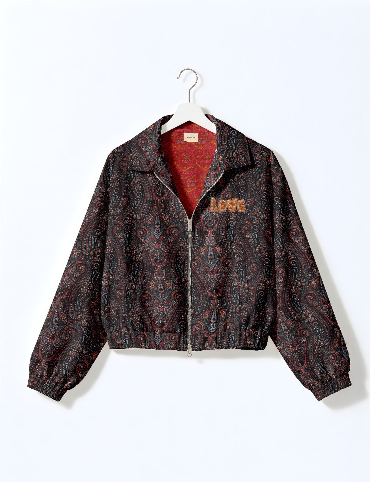 Love Bomber Jacket made from recycled fabric, featuring hand-stitched Aari embroidery. A unique piece of zero-waste clothing, part of the circular fashion movement. Designed with upcycled materials for a stylish yet environmentally friendly clothing choice.