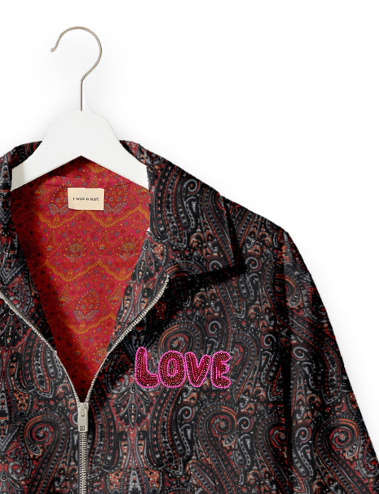 Love Bomber Jacket made from recycled fabric, featuring hand-stitched Aari embroidery. A unique piece of zero-waste clothing, part of the circular fashion movement. Designed with upcycled materials for a stylish yet environmentally friendly clothing choice.