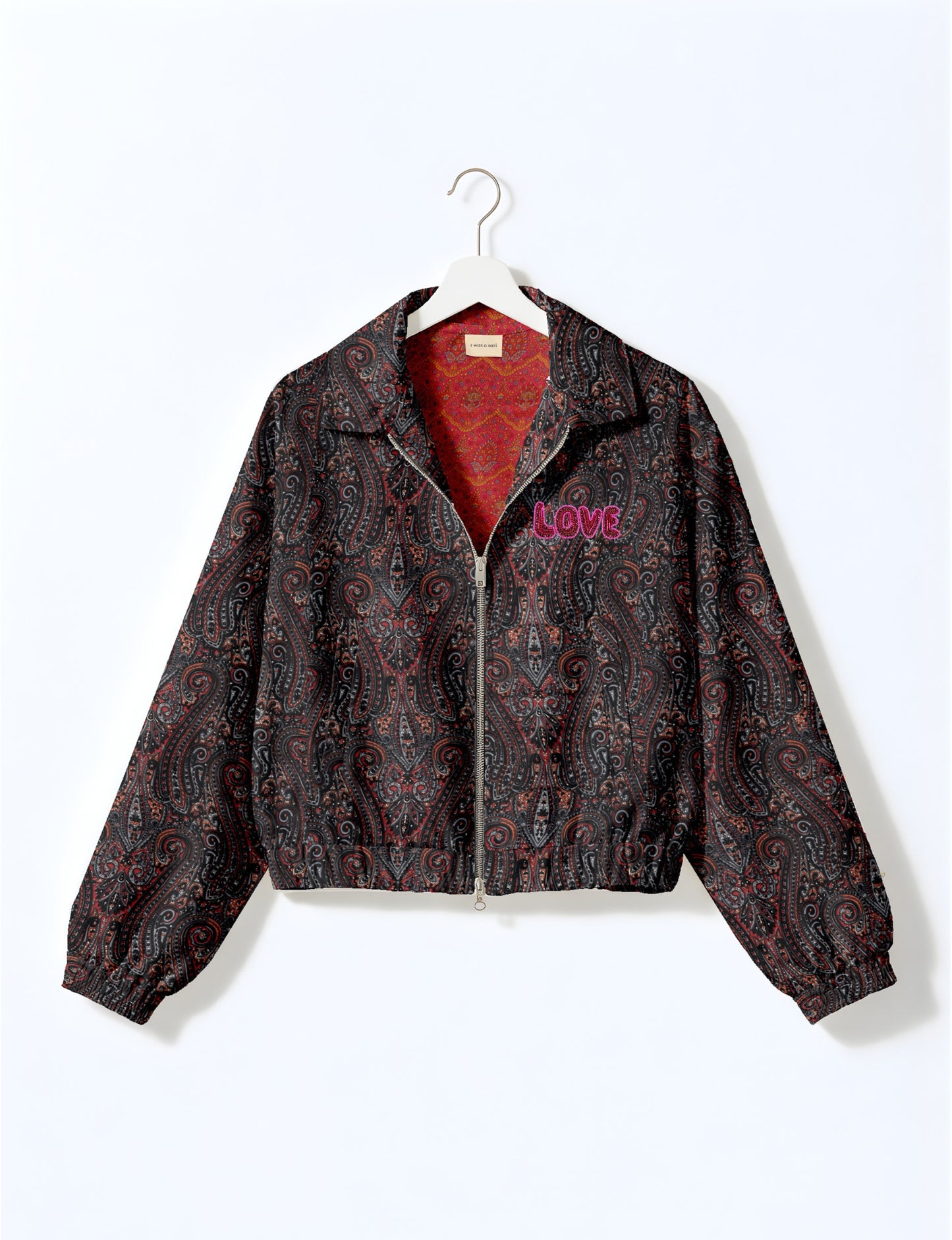 Love Bomber Jacket made from recycled fabric, featuring hand-stitched Aari embroidery. A unique piece of zero-waste clothing, part of the circular fashion movement. Designed with upcycled materials for a stylish yet environmentally friendly clothing choice.