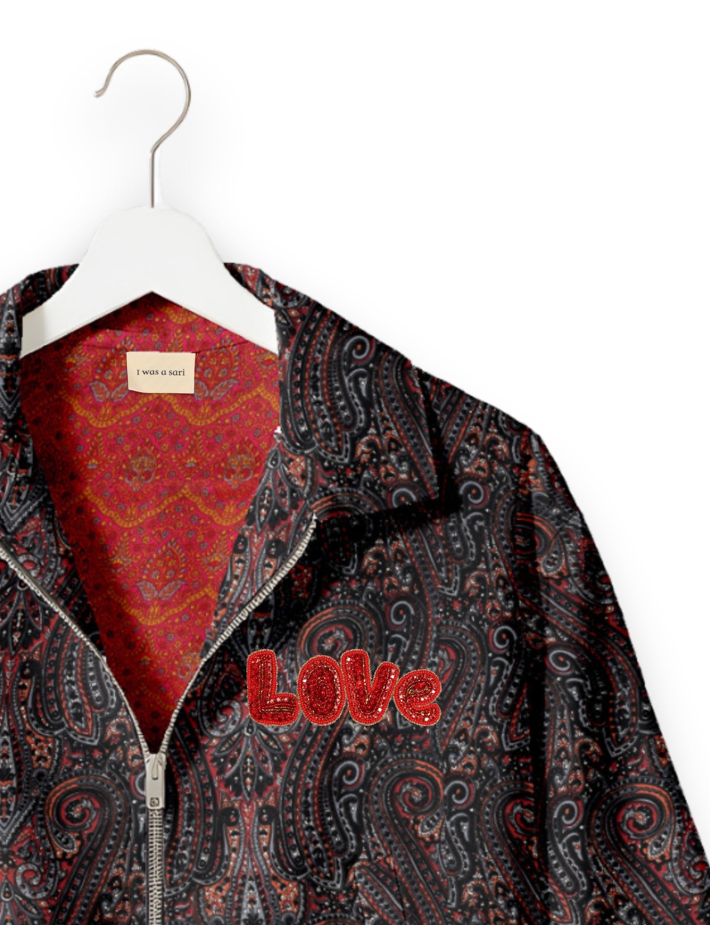 Love Bomber Jacket made from recycled fabric, featuring hand-stitched Aari embroidery. A unique piece of zero-waste clothing, part of the circular fashion movement. Designed with upcycled materials for a stylish yet environmentally friendly clothing choice.