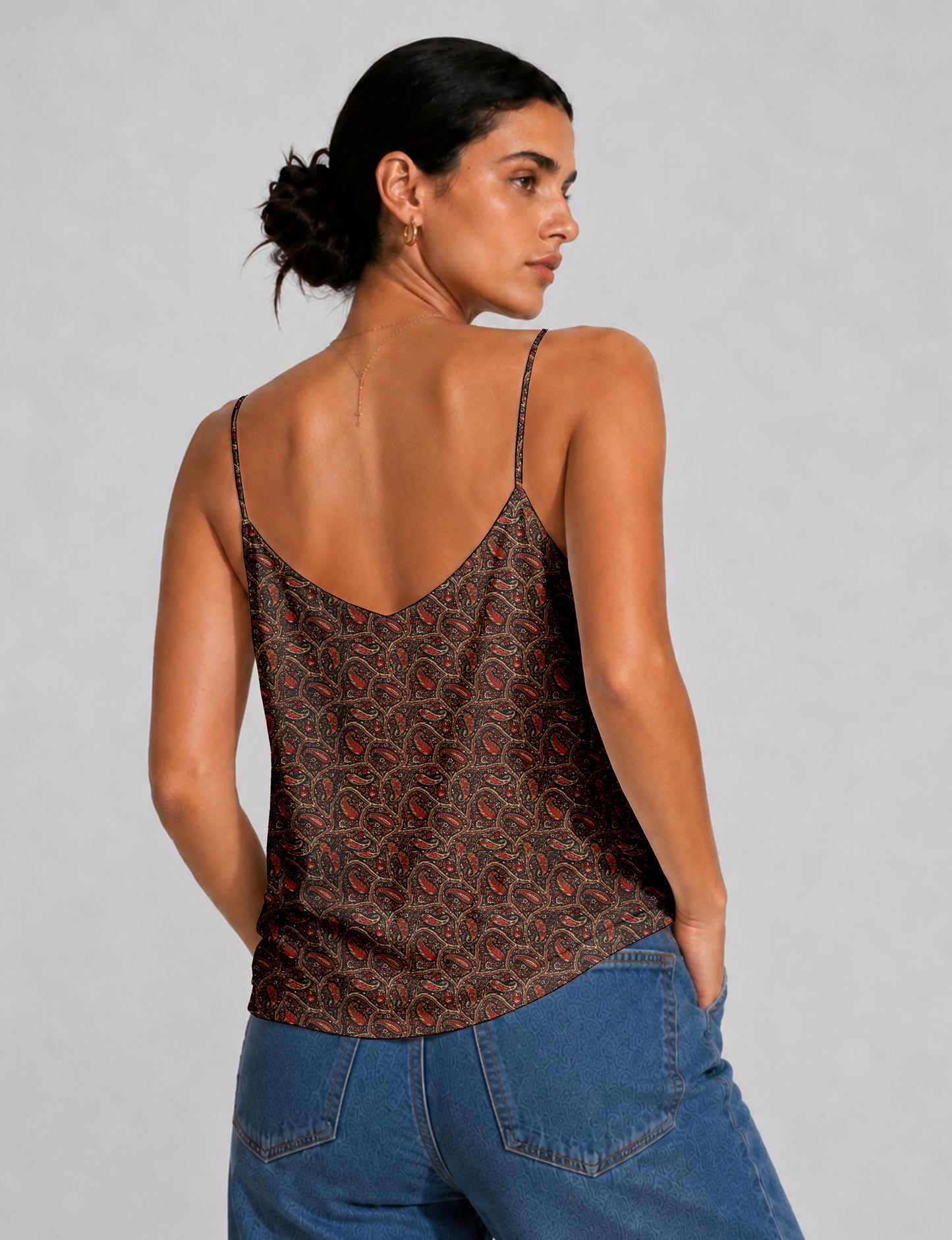 Women's sleeveless slip top with a relaxed straight fit, soft V-neckline, deep V-back, and delicate spaghetti straps.