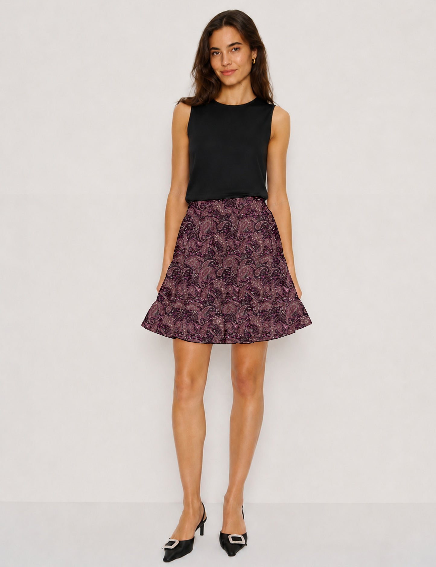 Short tiered skirt with a fitted waistband, knife pleats, softly flared silhouette, side seam pockets, and above-the-knee length.