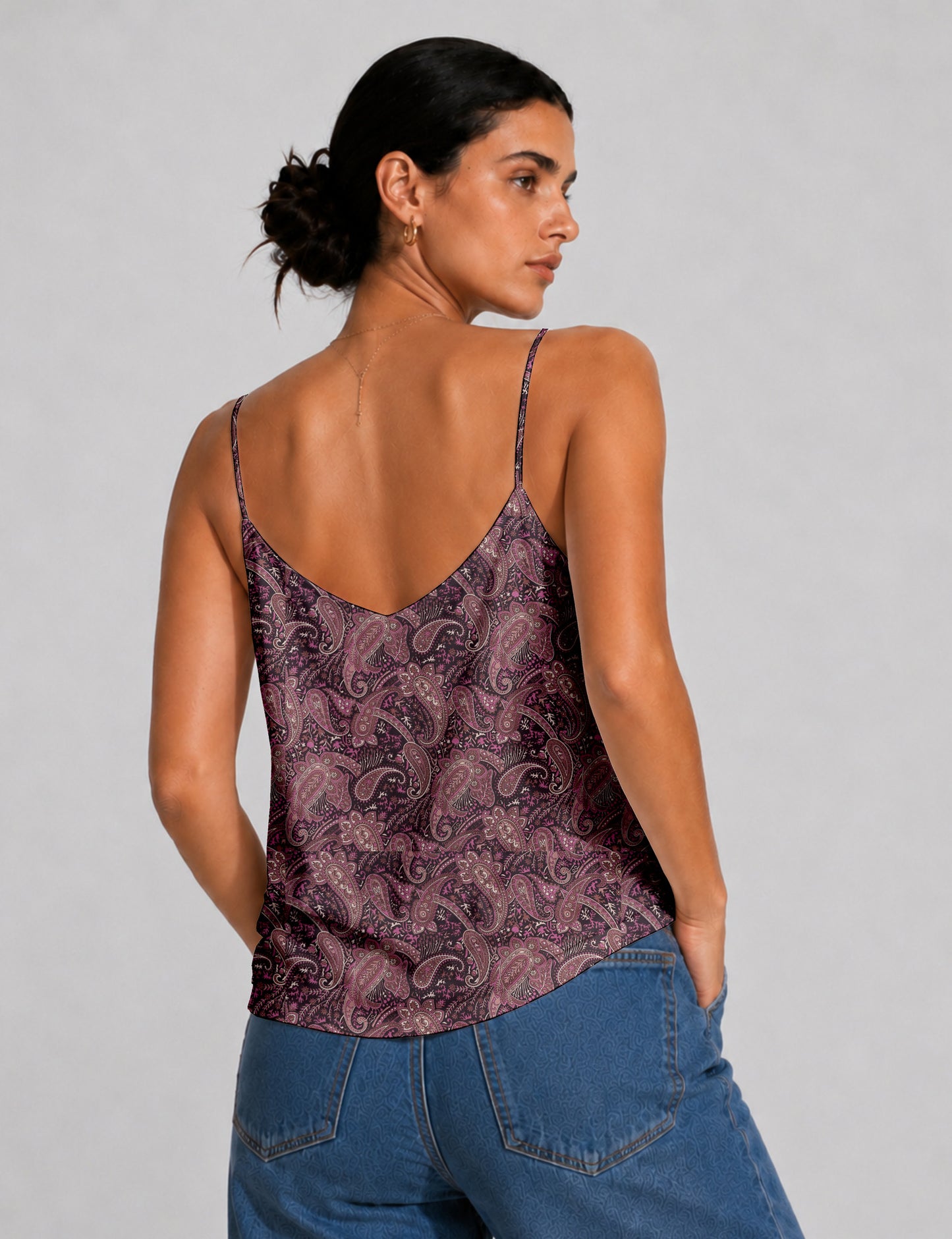 Women's sleeveless slip top with a relaxed straight fit, soft V-neckline, deep V-back, and delicate spaghetti straps.