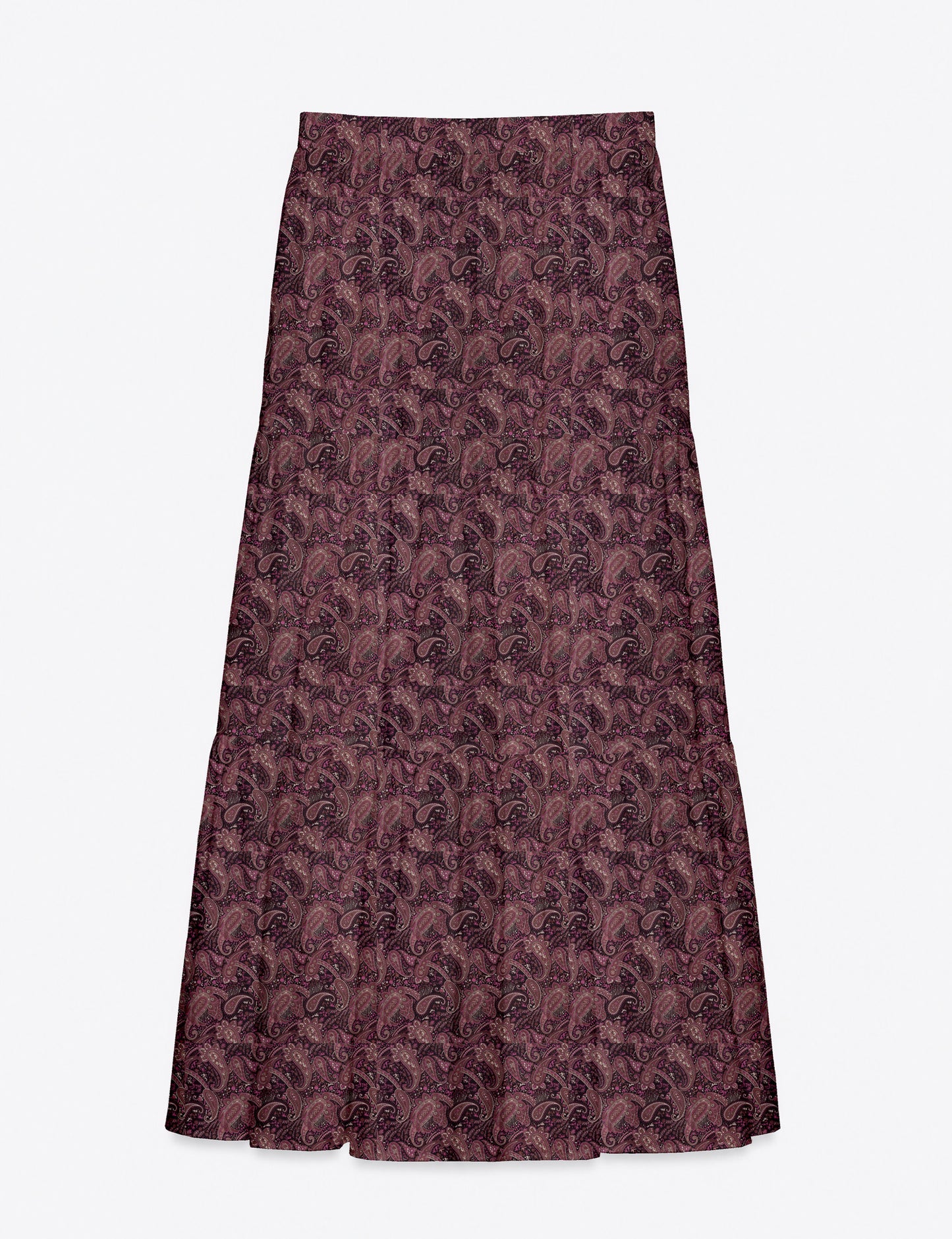 Woman wearing a yellow midi tiered skirt with a small geometric pattern, shown from the back, paired with beige top and