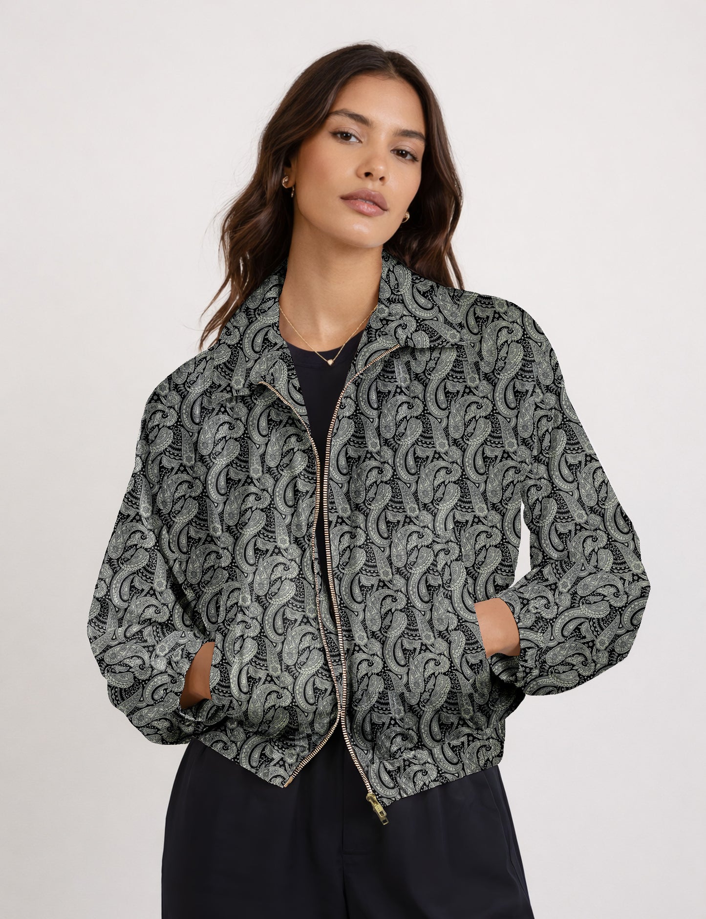 Woman wearing a yellow floral bomber jacket with front zipper, elastic cuffs, and side pockets, shown from front view