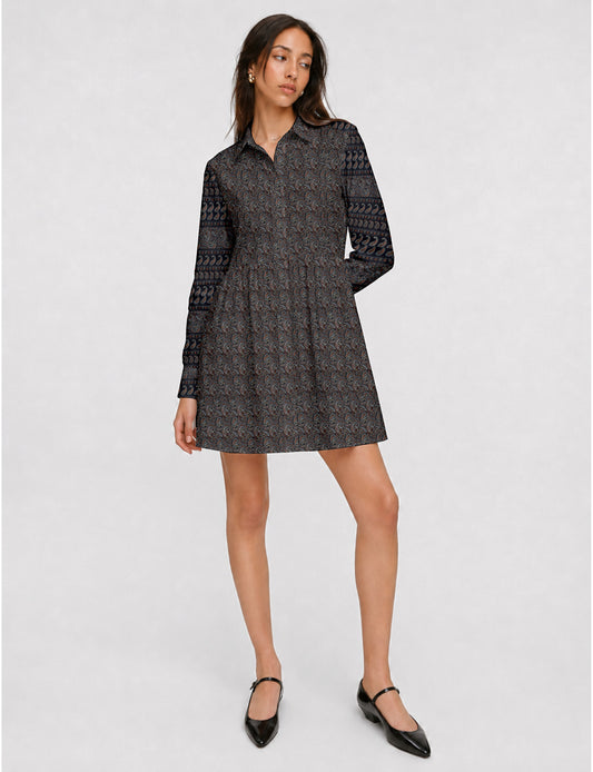 Short shirt dress with a relaxed A-line silhouette, point collar, partial button placket, gathered waist, side pockets, and full-length cuffed sleeves.