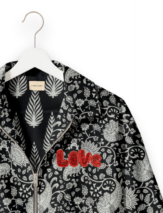 Love Bomber Jacket made from recycled fabric, featuring hand-stitched Aari embroidery. A unique piece of zero-waste clothing, part of the circular fashion movement. Designed with upcycled materials for a stylish yet environmentally friendly clothing choice.