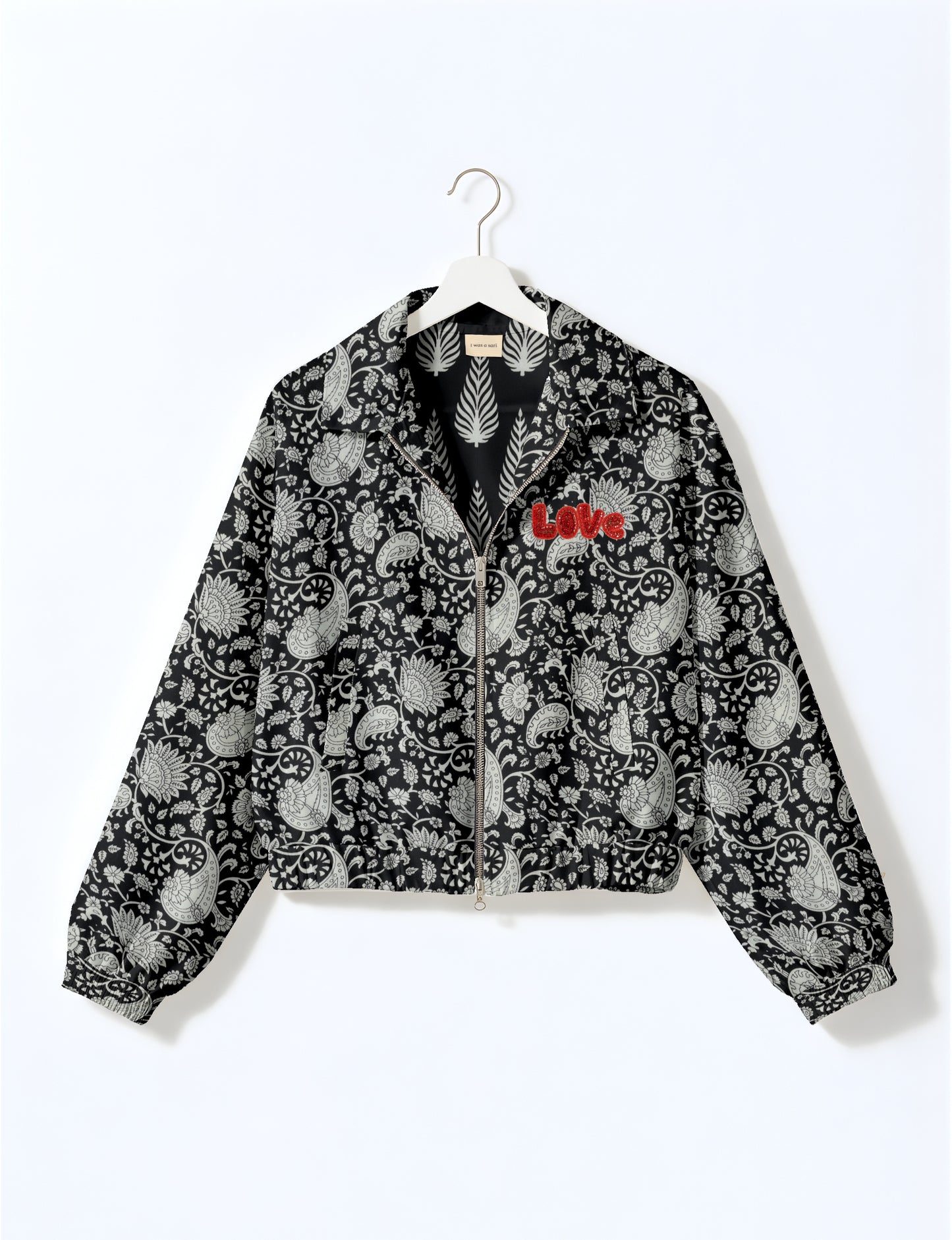 Love Bomber Jacket made from recycled fabric, featuring hand-stitched Aari embroidery. A unique piece of zero-waste clothing, part of the circular fashion movement. Designed with upcycled materials for a stylish yet environmentally friendly clothing choice.