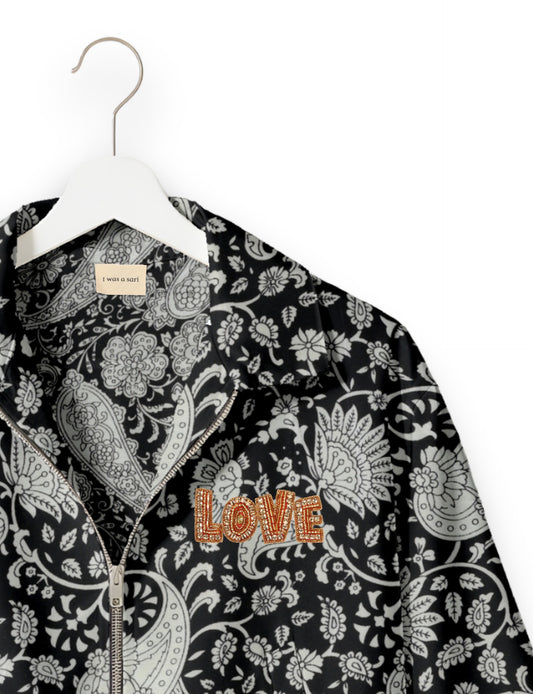 Love Bomber Jacket made from recycled fabric, featuring hand-stitched Aari embroidery. A unique piece of zero-waste clothing, part of the circular fashion movement. Designed with upcycled materials for a stylish yet environmentally friendly clothing choice.