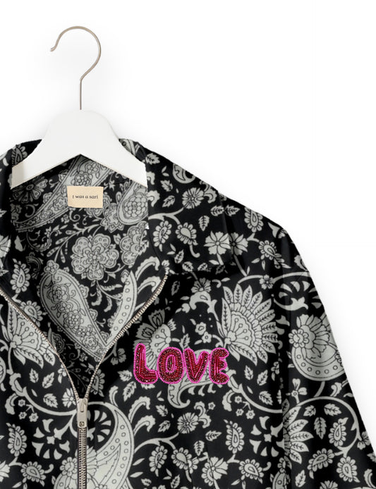 Love Bomber Jacket made from recycled fabric, featuring hand-stitched Aari embroidery. A unique piece of zero-waste clothing, part of the circular fashion movement. Designed with upcycled materials for a stylish yet environmentally friendly clothing choice.