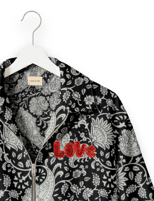 Love Bomber Jacket made from recycled fabric, featuring hand-stitched Aari embroidery. A unique piece of zero-waste clothing, part of the circular fashion movement. Designed with upcycled materials for a stylish yet environmentally friendly clothing choice.