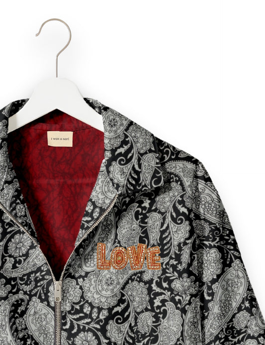 Love Bomber Jacket made from recycled fabric, featuring hand-stitched Aari embroidery. A unique piece of zero-waste clothing, part of the circular fashion movement. Designed with upcycled materials for a stylish yet environmentally friendly clothing choice.