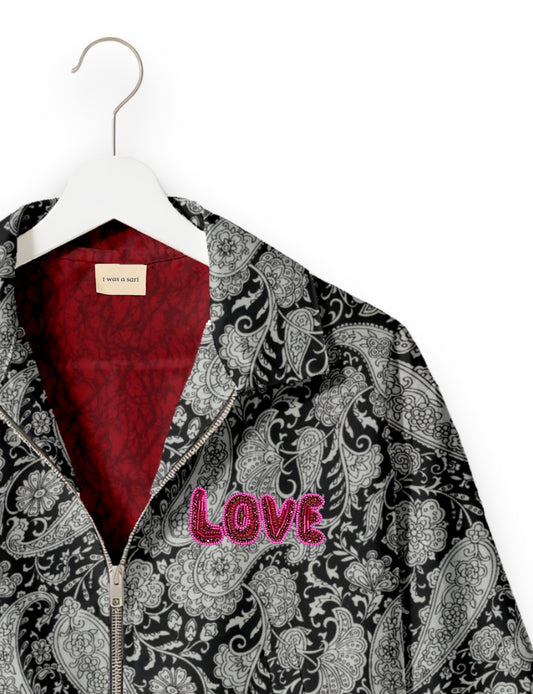 Love Bomber Jacket made from recycled fabric, featuring hand-stitched Aari embroidery. A unique piece of zero-waste clothing, part of the circular fashion movement. Designed with upcycled materials for a stylish yet environmentally friendly clothing choice.