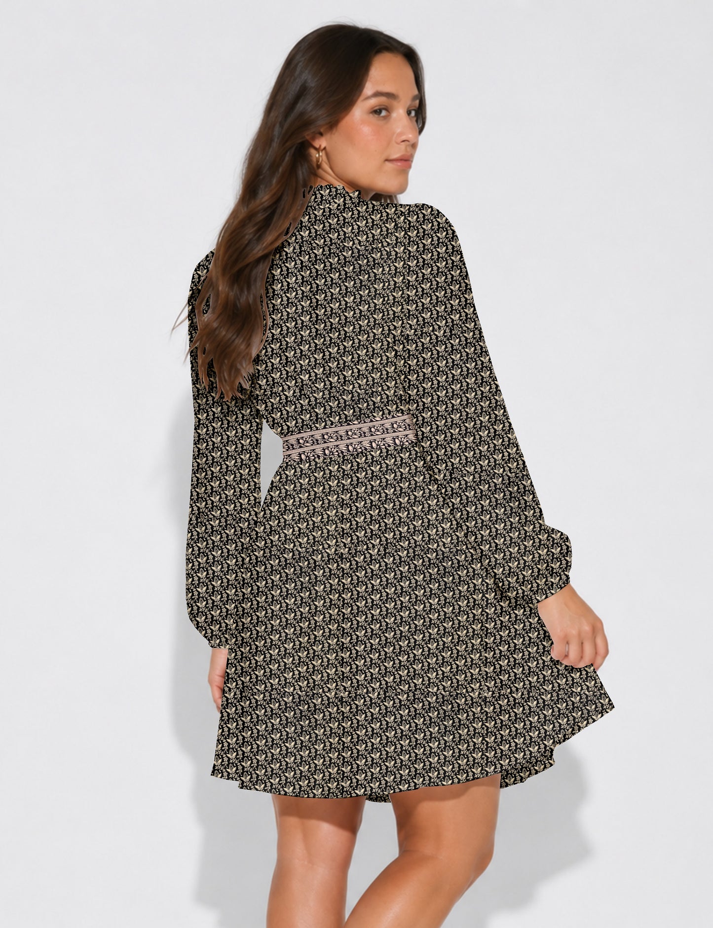 Swing dress with detachable tie belt, gathered ruffle neckline, full-length voluminous sleeves, elastic cuffs, and relaxed A-line silhouette in an above-knee length.