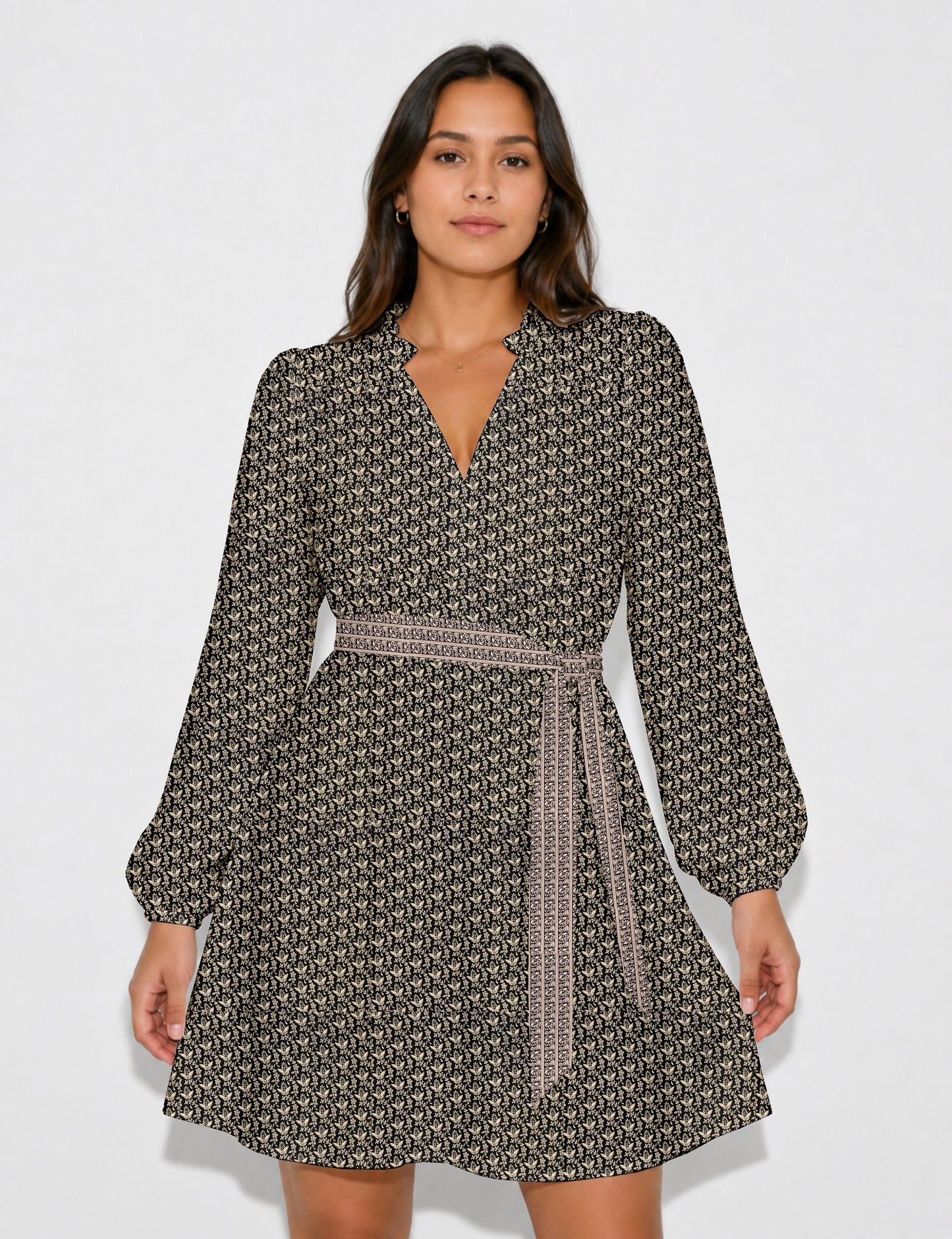 Swing dress with detachable tie belt, gathered ruffle neckline, full-length voluminous sleeves, elastic cuffs, and relaxed A-line silhouette in an above-knee length.