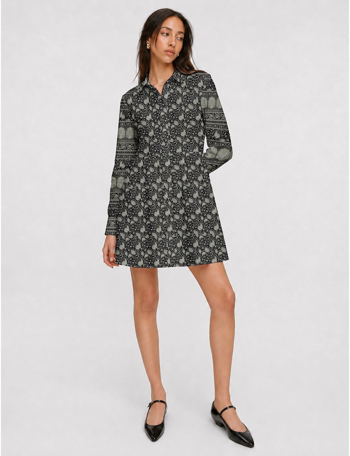 Short shirt dress with a relaxed A-line silhouette, point collar, partial button placket, gathered waist, side pockets, and full-length cuffed sleeves.