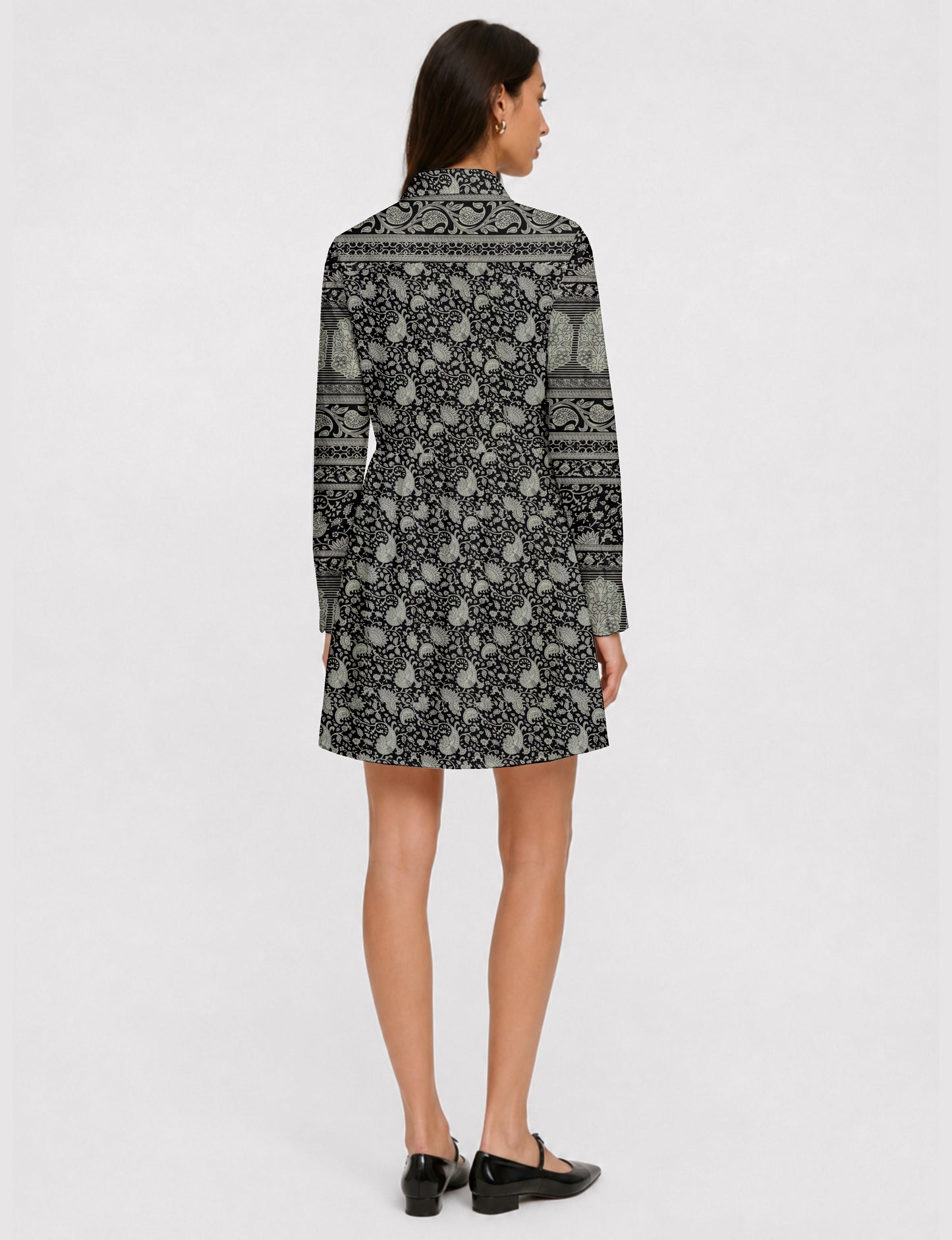 Short shirt dress with a relaxed A-line silhouette, point collar, partial button placket, gathered waist, side pockets, and full-length cuffed sleeves.