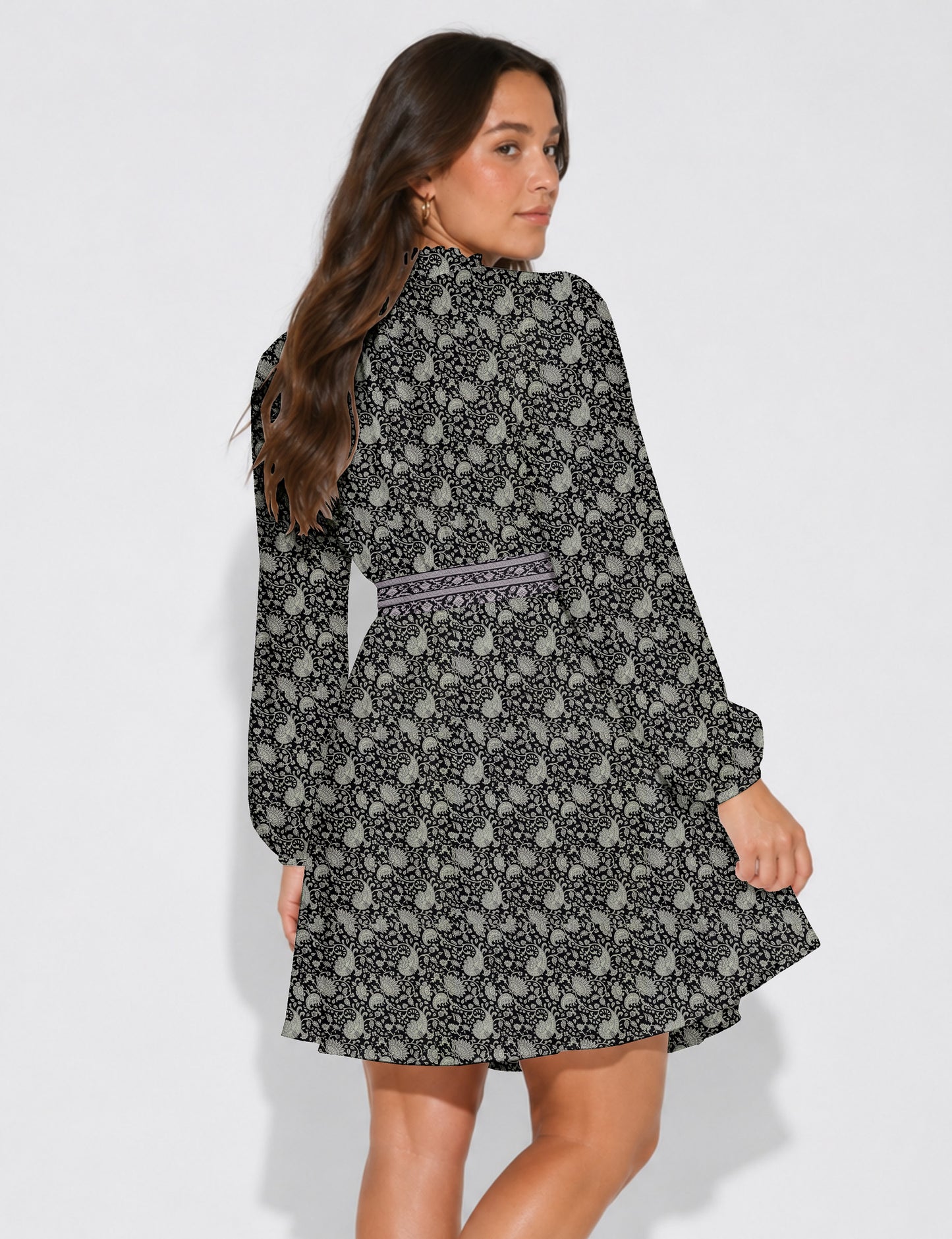 Swing dress with detachable tie belt, gathered ruffle neckline, full-length voluminous sleeves, elastic cuffs, and relaxed A-line silhouette in an above-knee length.