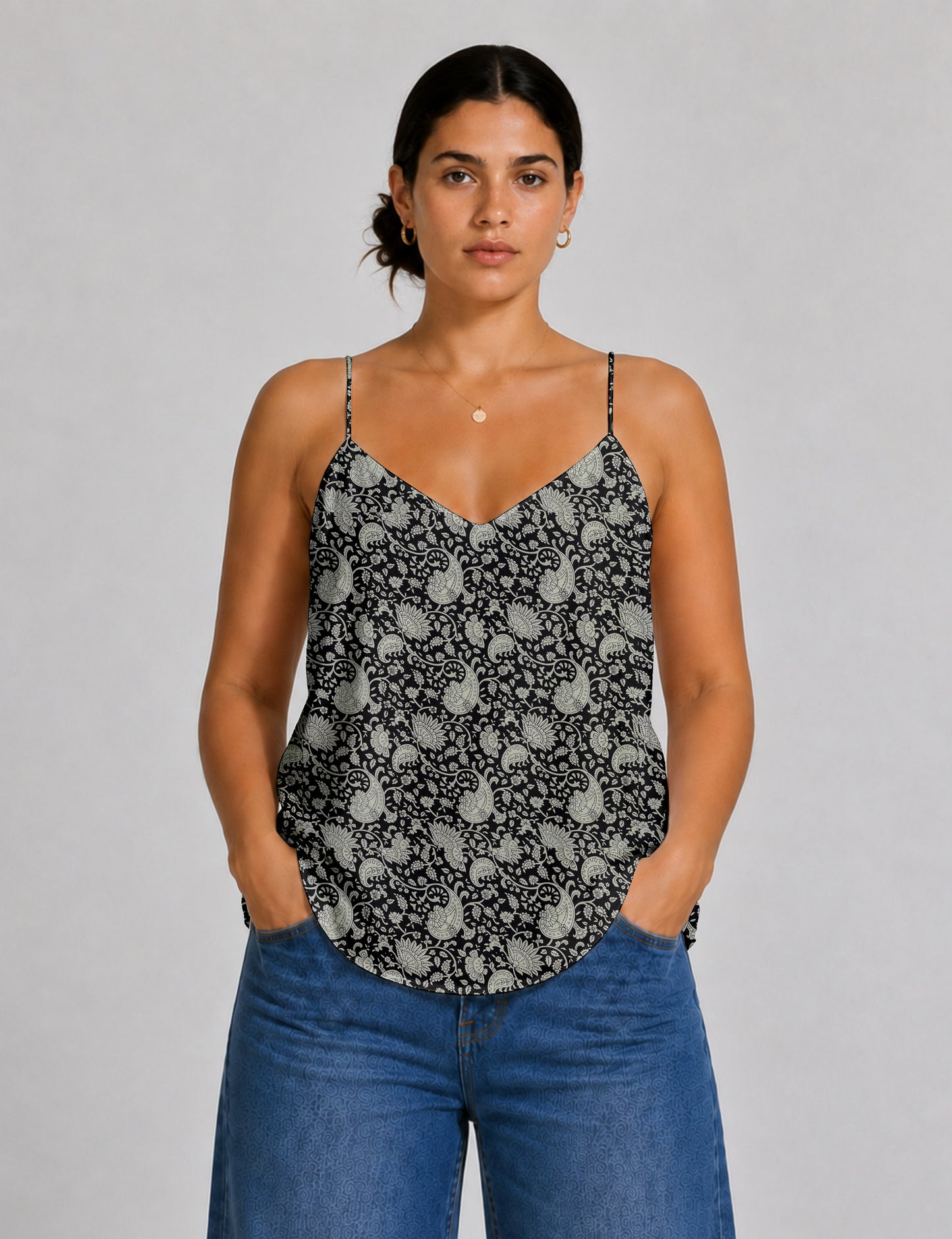 Women's sleeveless slip top with a relaxed straight fit, soft V-neckline, deep V-back, and delicate spaghetti straps.