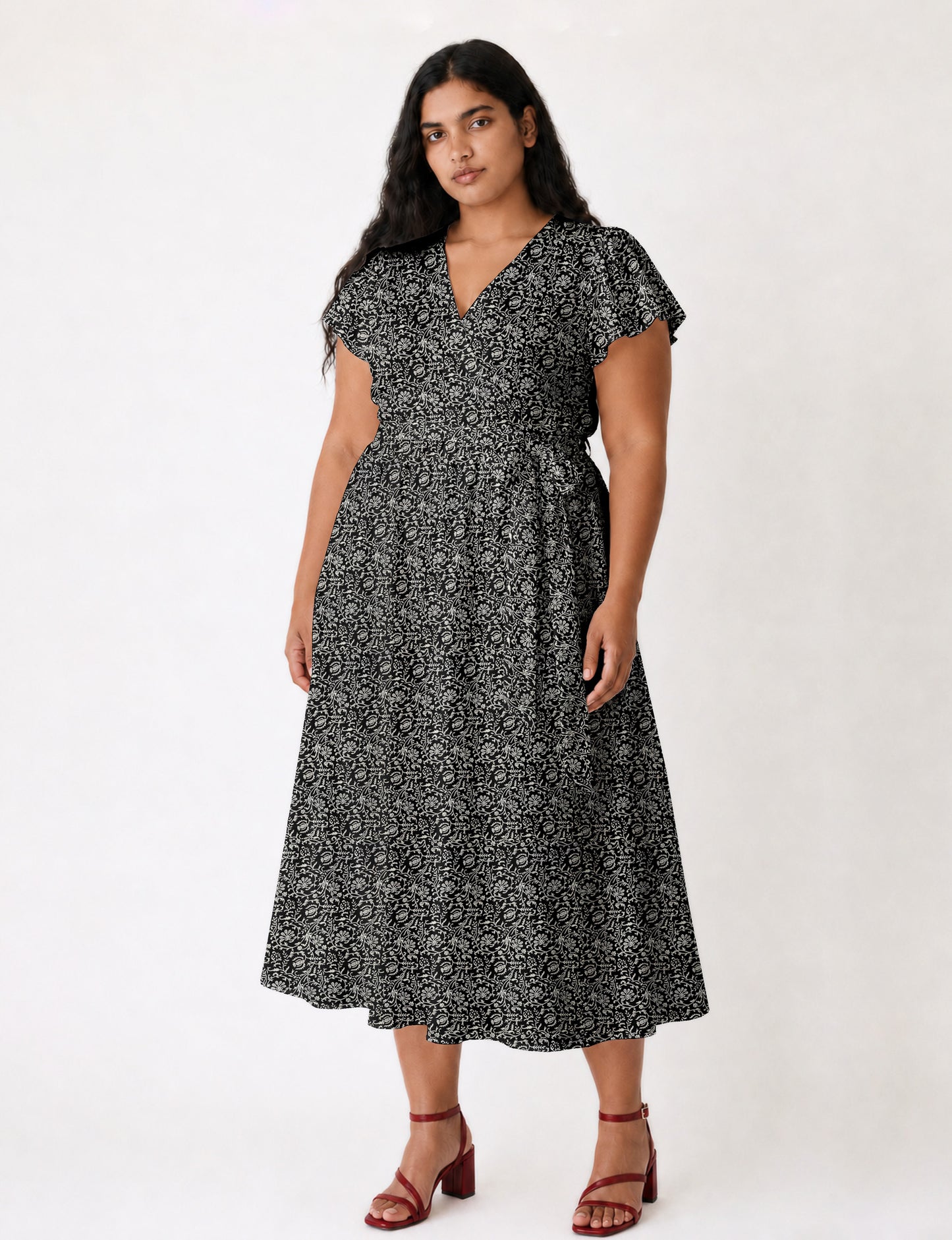 Elegant midi wrap dress with a V-neckline, adjustable waist tie, fitted bodice, and flared skirt for a timeless, flattering silhouette.