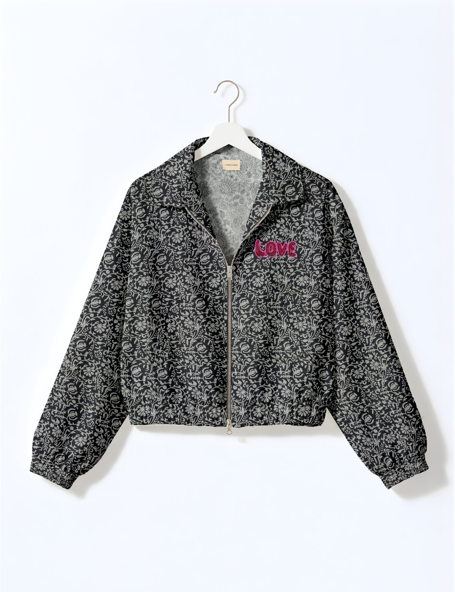 Love Bomber Jacket made from recycled fabric, featuring hand-stitched Aari embroidery. A unique piece of zero-waste clothing, part of the circular fashion movement. Designed with upcycled materials for a stylish yet environmentally friendly clothing choice.