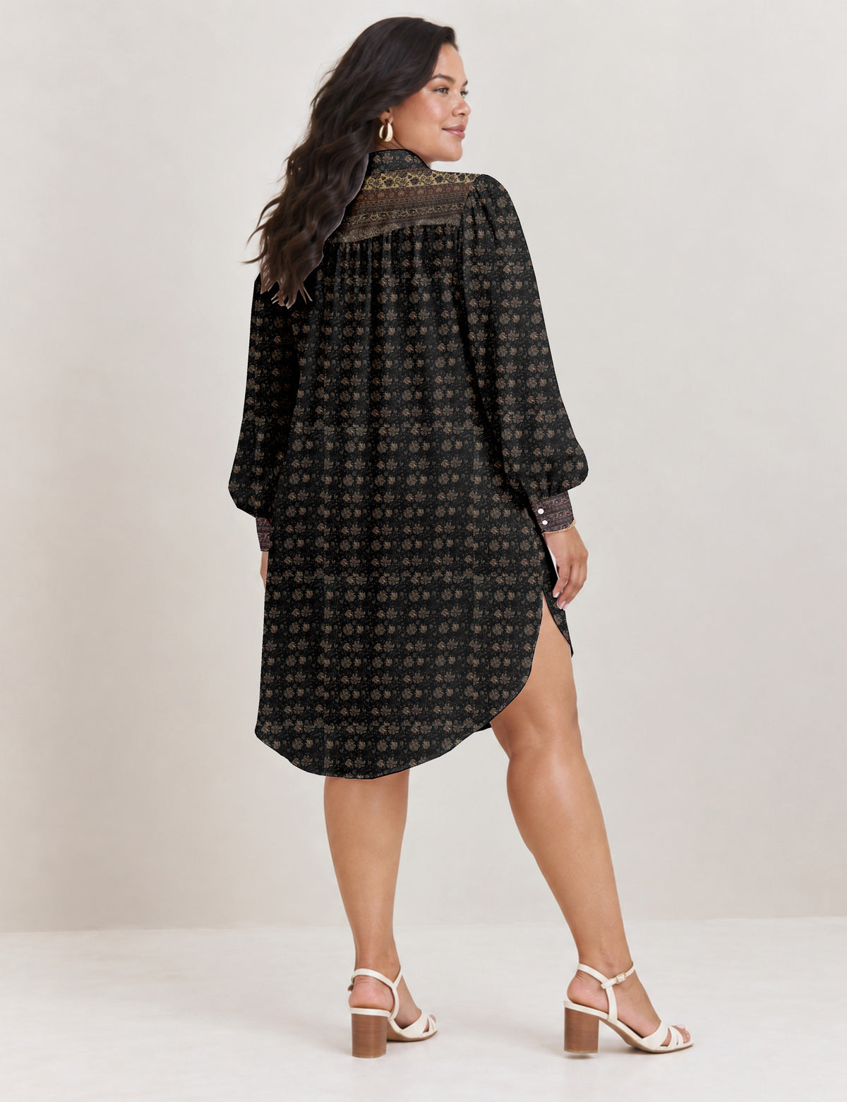 High low shirt with a relaxed fit, button-down front, classic collar, gathered shoulders and full-length blouson sleeves.