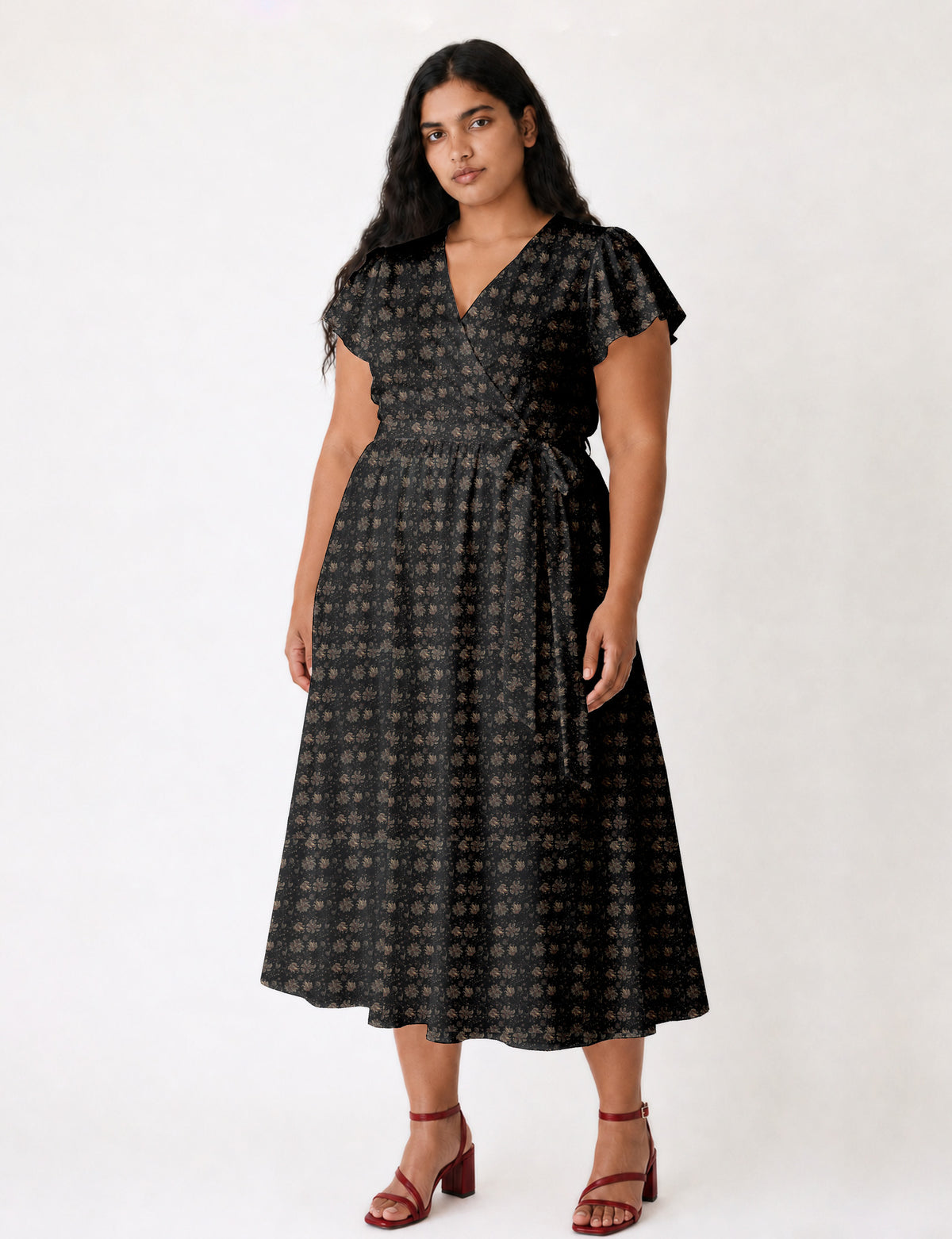 Elegant midi wrap dress with a V-neckline, adjustable waist tie, fitted bodice, and flared skirt for a timeless, flattering silhouette.
