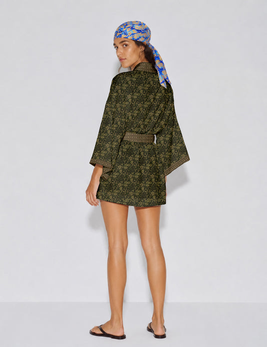 Short kimono robe with wrap front, V-neckline, wide sleeves, waist tie, and concealed skort detail.