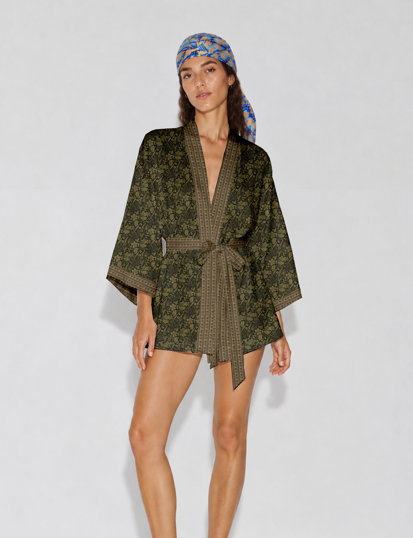 Short kimono robe with wrap front, V-neckline, wide sleeves, waist tie, and concealed skort detail.