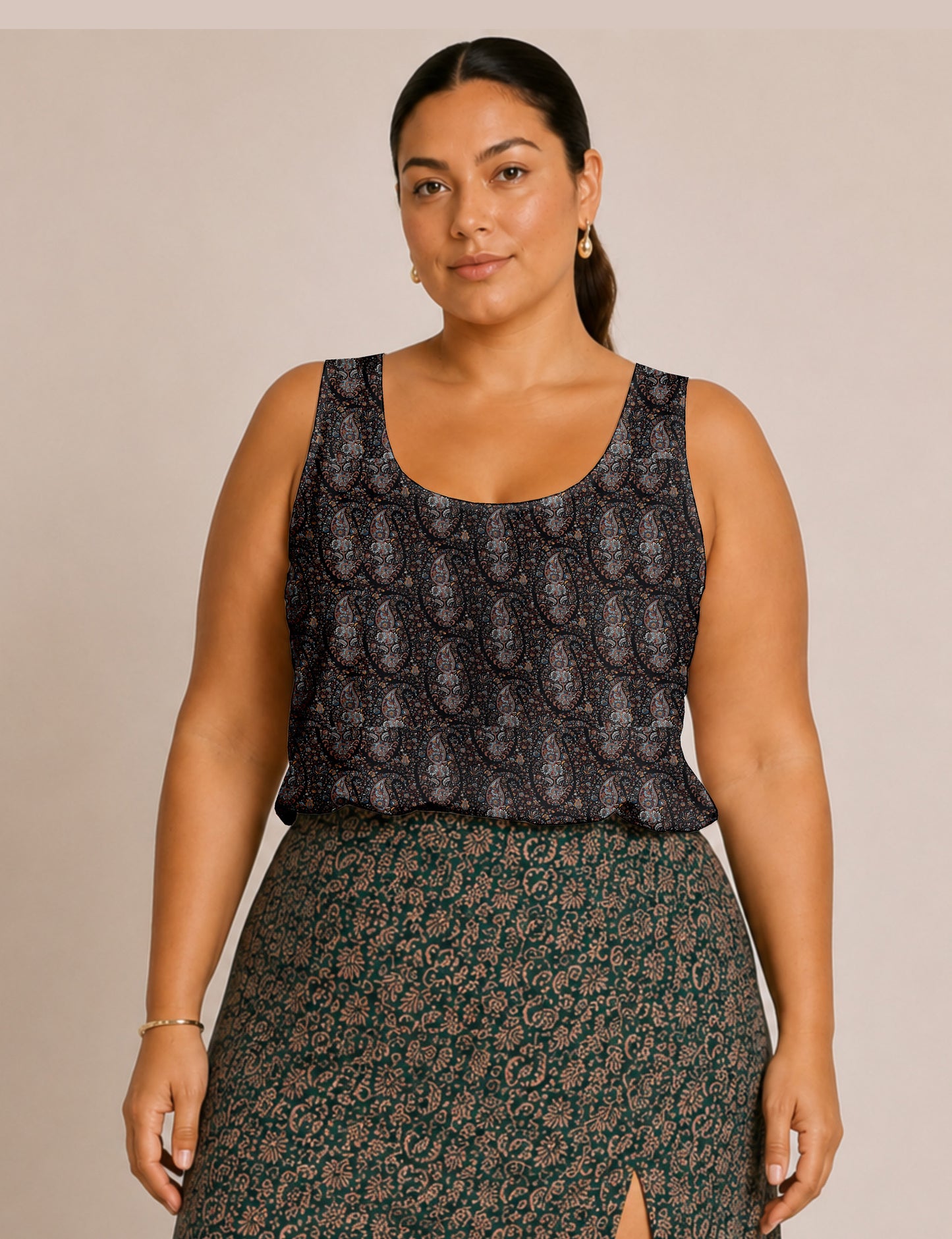 Women's sleeveless blouse with a relaxed straight fit, wide scoop neckline, deep scoop back, and hip-length silhouette.