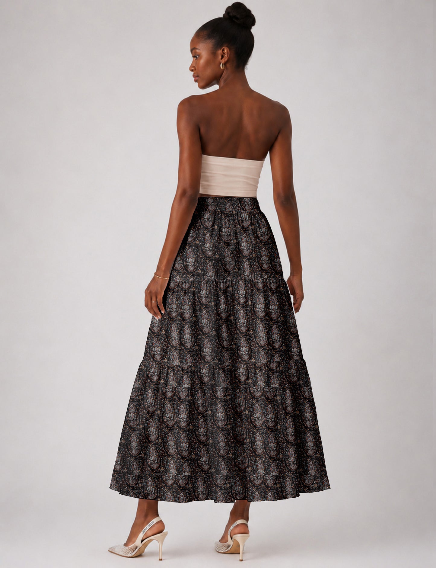 Yellow midi tiered skirt with small dark geometric micro pattern, flat lay front view