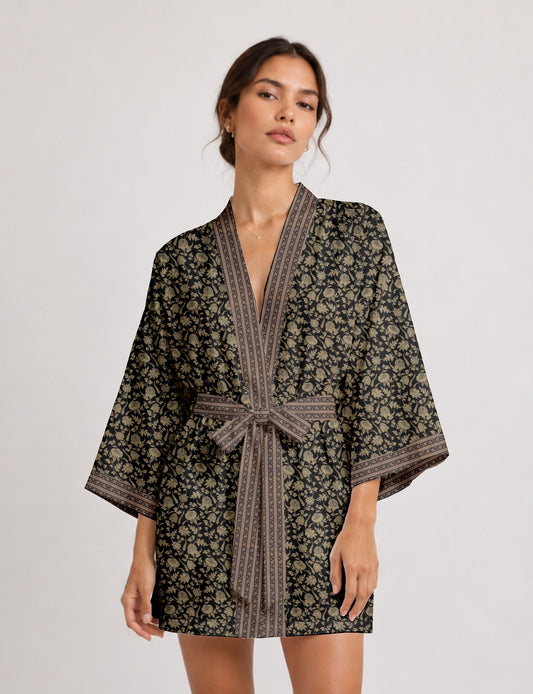 Short kimono robe with wrap front, V-neckline, wide sleeves, waist tie, and concealed skort detail.