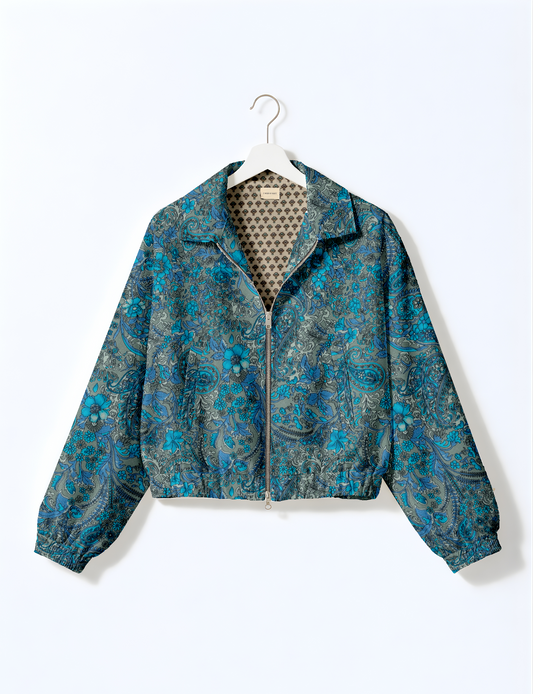 Upcycled Bomber Jacket made from recycled sari materials, featuring a cute cropped shape, elasticated hem and cuffs, and contrast sari print lining. Sustainable apparel promoting eco-friendly fashion and ethical clothing.