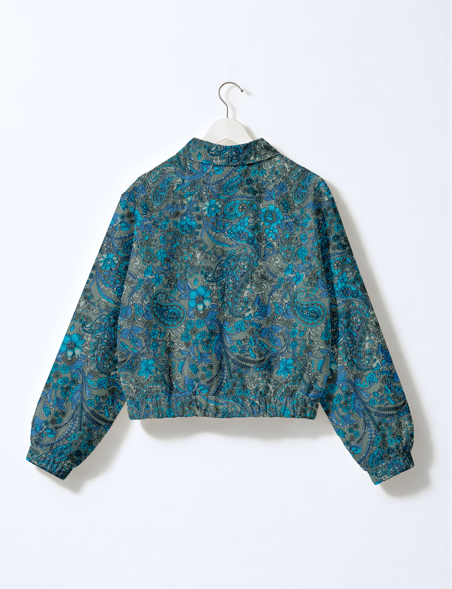 Upcycled Bomber Jacket made from recycled sari materials, featuring a cute cropped shape, elasticated hem and cuffs, and contrast sari print lining. Sustainable apparel promoting eco-friendly fashion and ethical clothing.