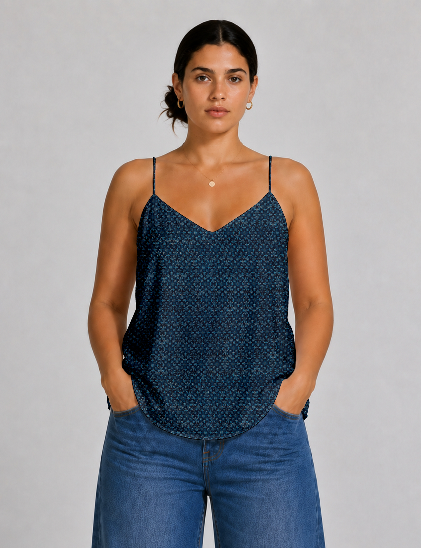 Women's sleeveless slip top with a relaxed straight fit, soft V-neckline, deep V-back, and delicate spaghetti straps.